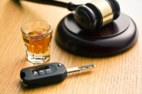 Gavel, alcohol and car key on a table - Tallahassee DUI attorney